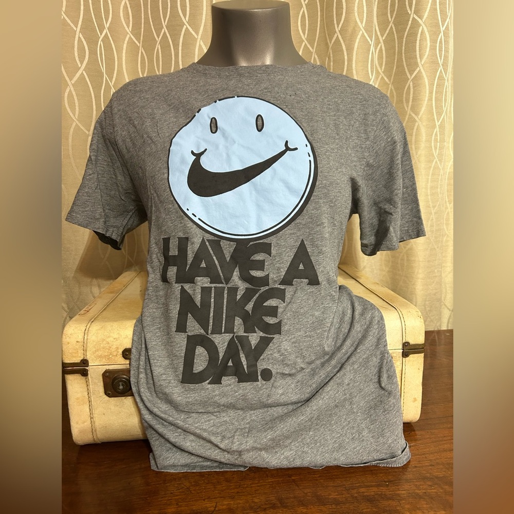 “Nike” Have A Nike Day Smilie Face Tee Shirt
Grey With Light Blue Face Unisex
